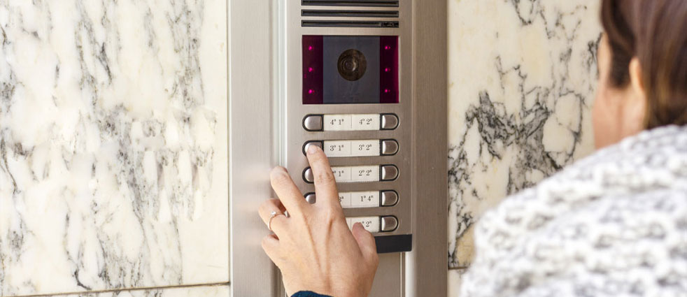 Video intercom on a residential block with video door entry and lock