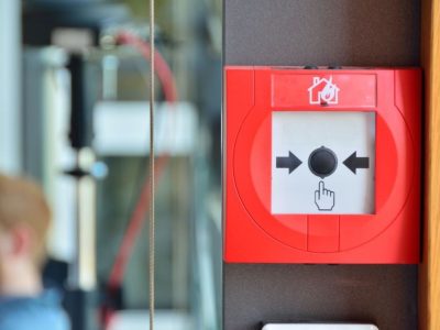 Commercial Fire alarm manual call point installed on business premises in the UK